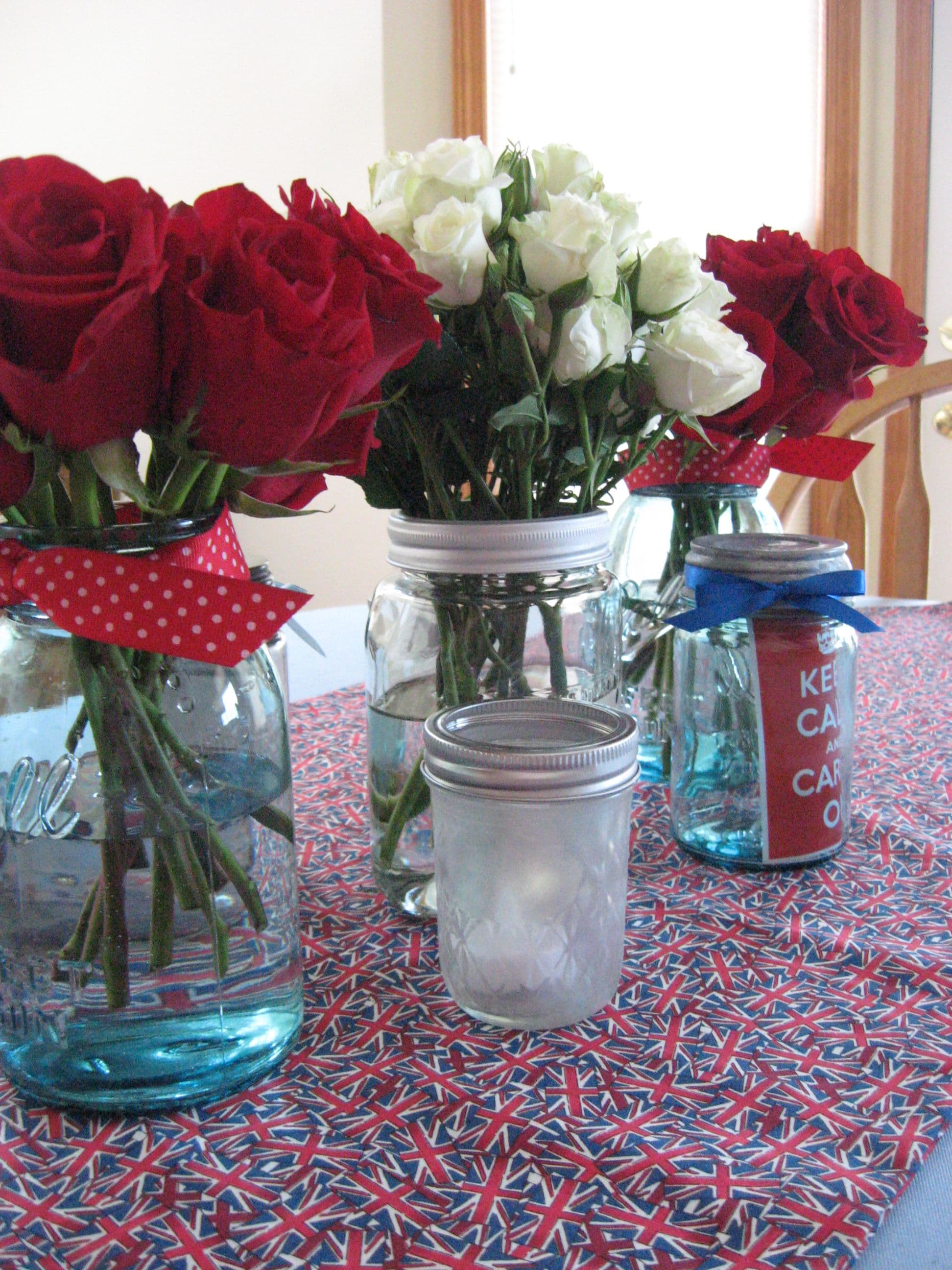 Red, White, and Blue Mason Jar Centerpieces with American Flag Cloth